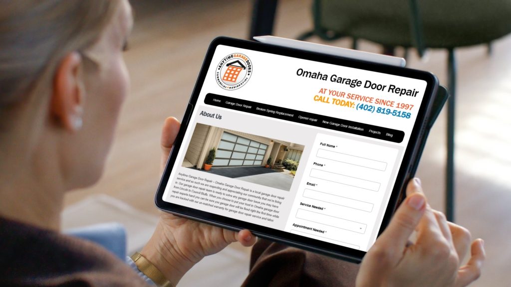 Customer viewing the Omaha Garage Door Repair website on a tablet device