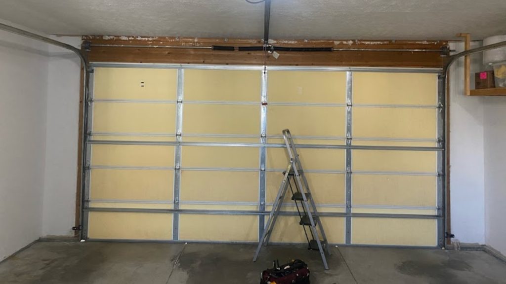 A garage door with threshold seal to prevent water leaks
