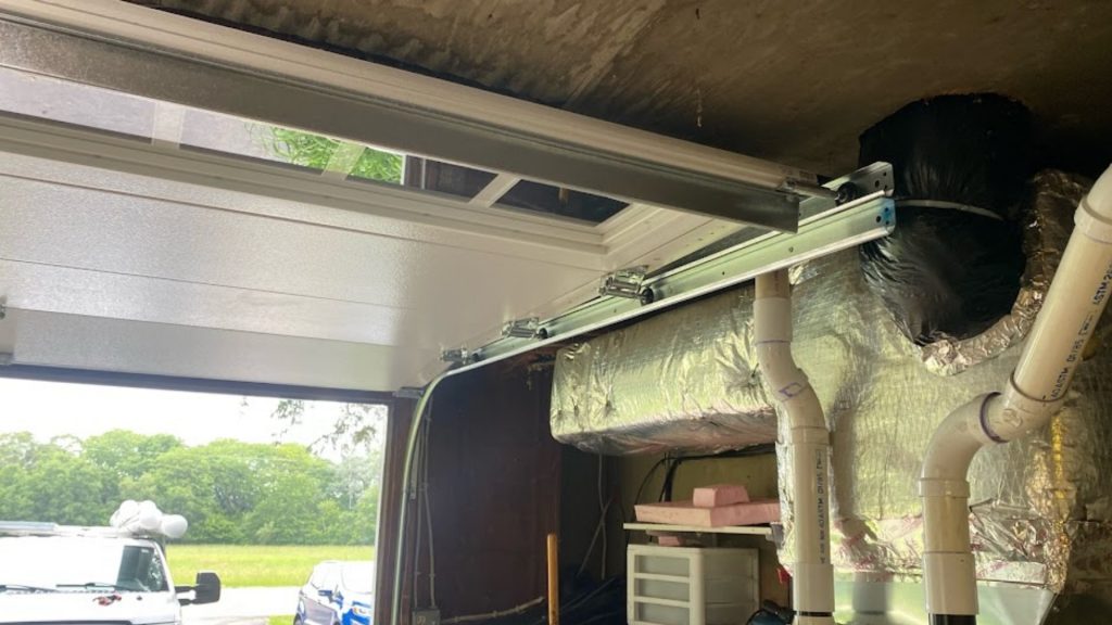 A garage door with top caps weatherstripping