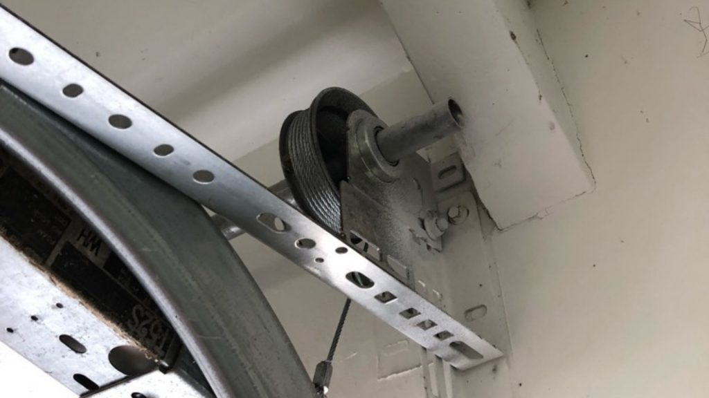 A garage door cable wound in its drum
