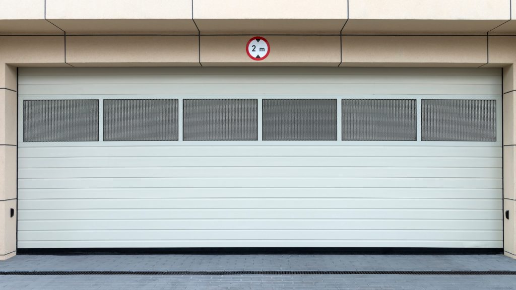 A garage door with T-style garage door seal