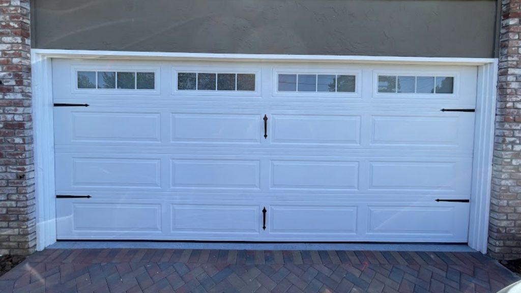 Energy efficient garage doors with insulated windows