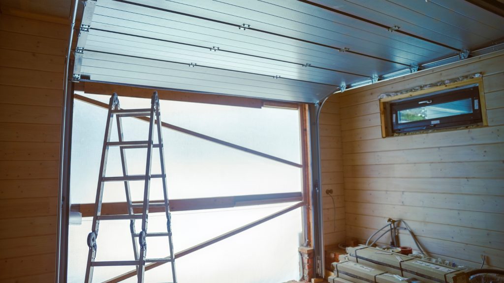 New garage door installation in progress, featuring horizontal metal panels